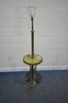 A FRENCH BRASS AND ONYX STANDARD LAMP, with a circular shelf, standing on triple foliate legs with