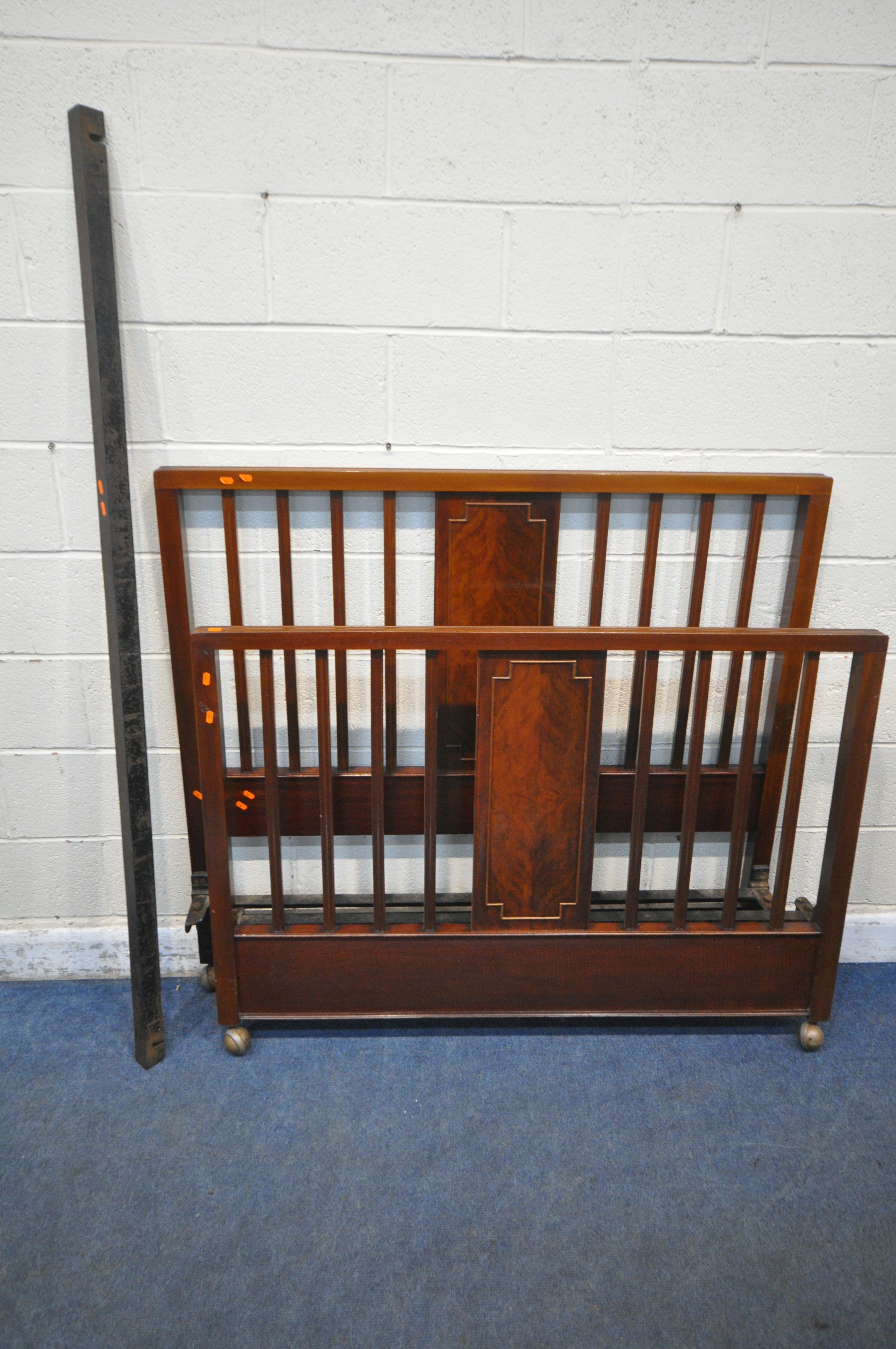 AN EARLY 20TH CENTURY MAHOGANY 4FT6 BEDSTEAD, with cast iron side rails (condition report: general