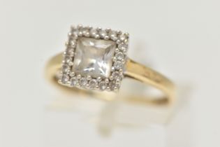 A 14CT GOLD GEM SET RING, the square shape colourless gem within a circular gem surround, gems