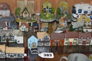 A LARGE QUANTITY OF WADE WHIMSEY- IN-THE- VALE HOUSES, comprising twenty seven Wade Whimsey-in -the-