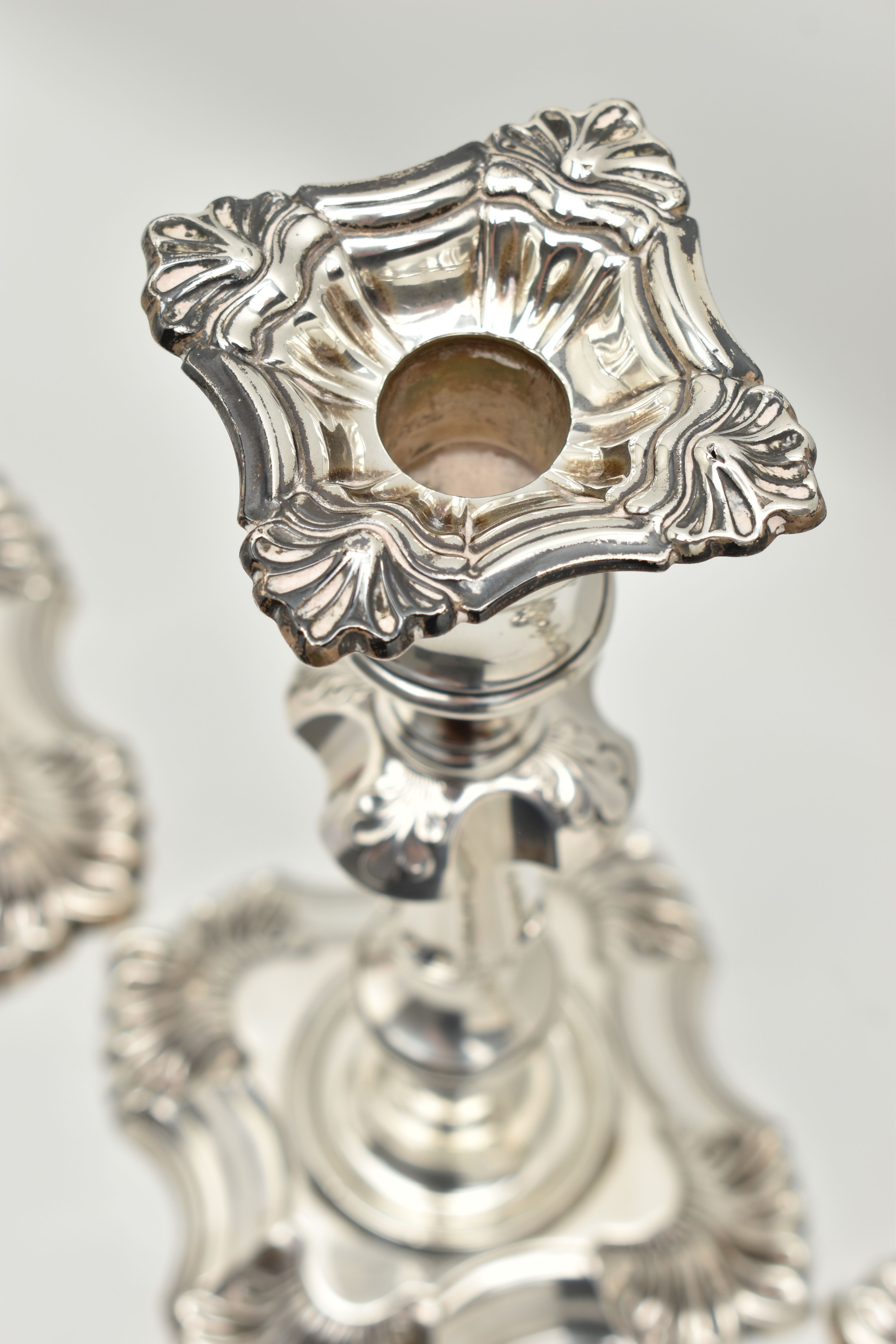 A GEORGE V SILVER SET OF FOUR CANDLESTICKS IN GEORGE II STYLE, with removable shaped square drip - Image 6 of 10