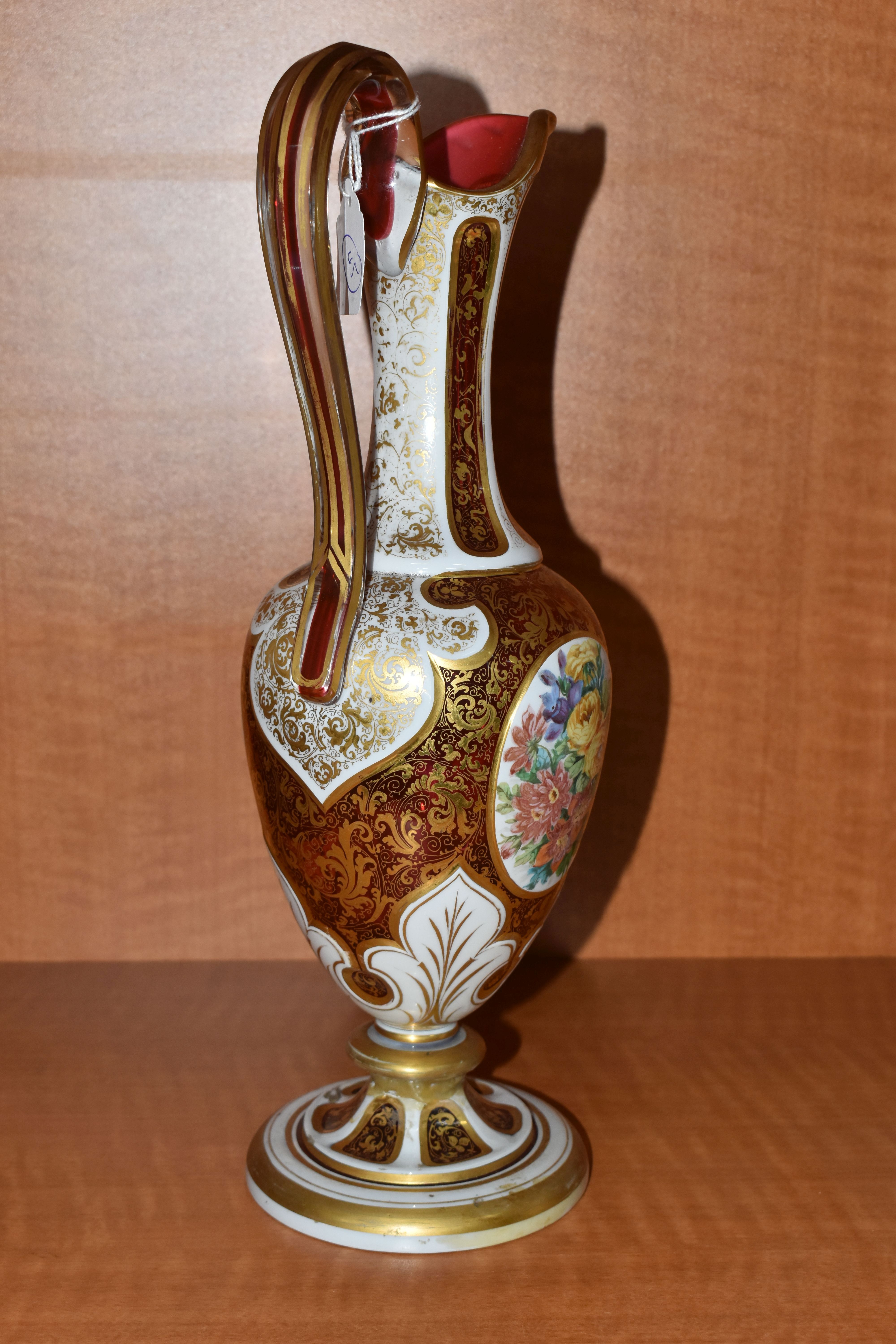 A SECOND HALF 19TH CENTURY CASED GLASS EWER, with 'S' scroll handle, the body overlaid with white - Image 4 of 13