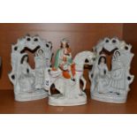THREE VICTORIAN STAFFORDSHIRE FIGURES, comprising two identical 'Fortune Teller' figure groups,