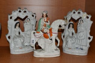 THREE VICTORIAN STAFFORDSHIRE FIGURES, comprising two identical 'Fortune Teller' figure groups,