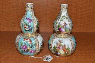 A PAIR OF LATE 19TH CONTINENTAL PORCELAIN VASES OF DOUBLE GOURD FORM, hand painted with