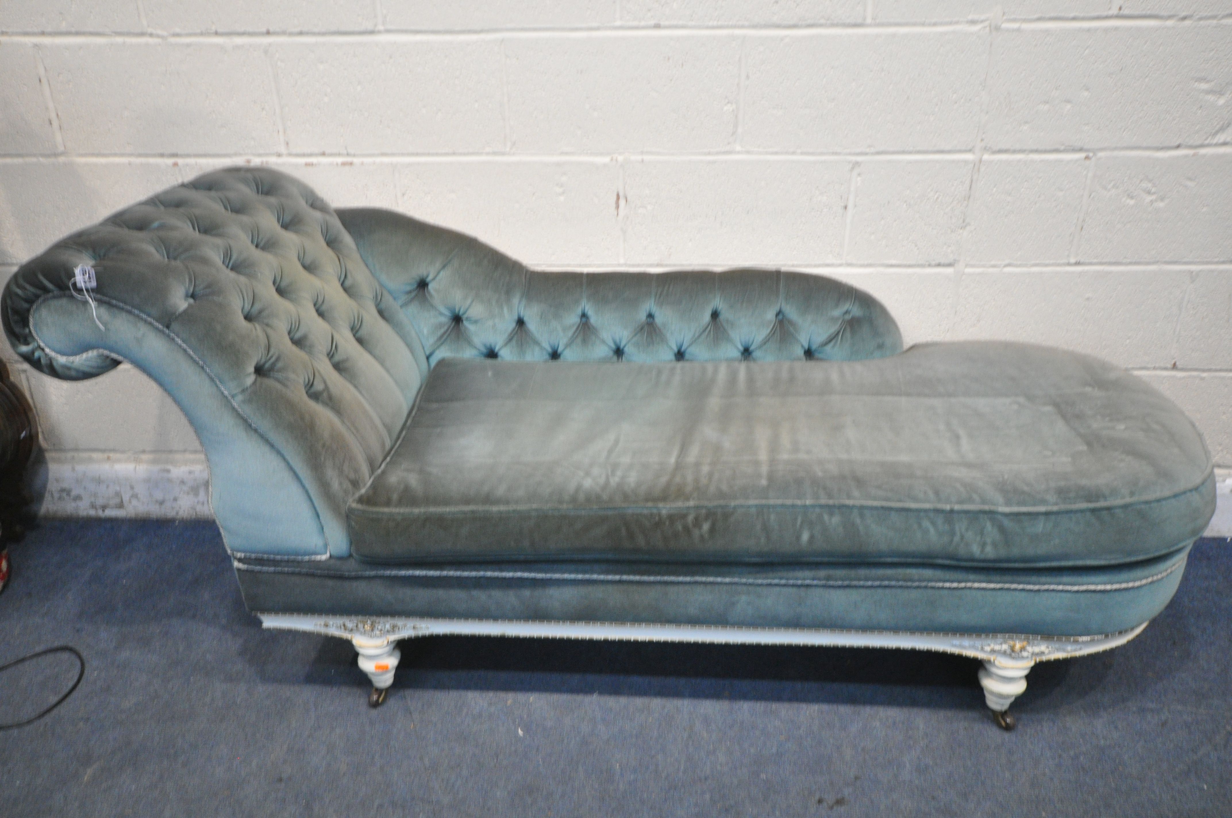 A FRENCH CREAM PAINTED CHAISE LONGUE, with blue buttoned upholstery, length 190cm (condition report: