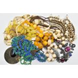 A BAG OF ASSORTED BEADED COSTUME JEWELLERY, to include a carved bone bead necklace, orange and