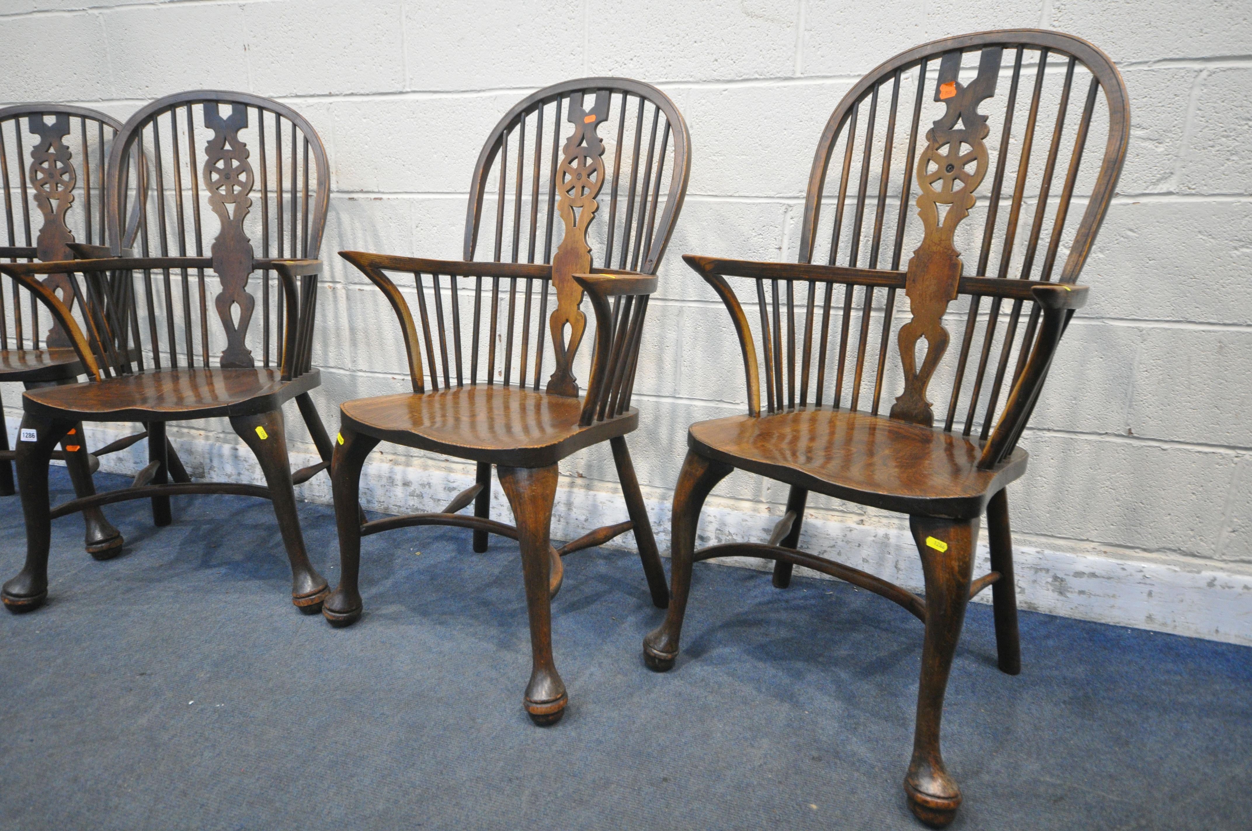A SET OF FOUR EARLY 20TH CENTURY ELM AND BEECH HOOP BACK WINDSOR ARMCHAIR, with a wheel splat - Image 5 of 7