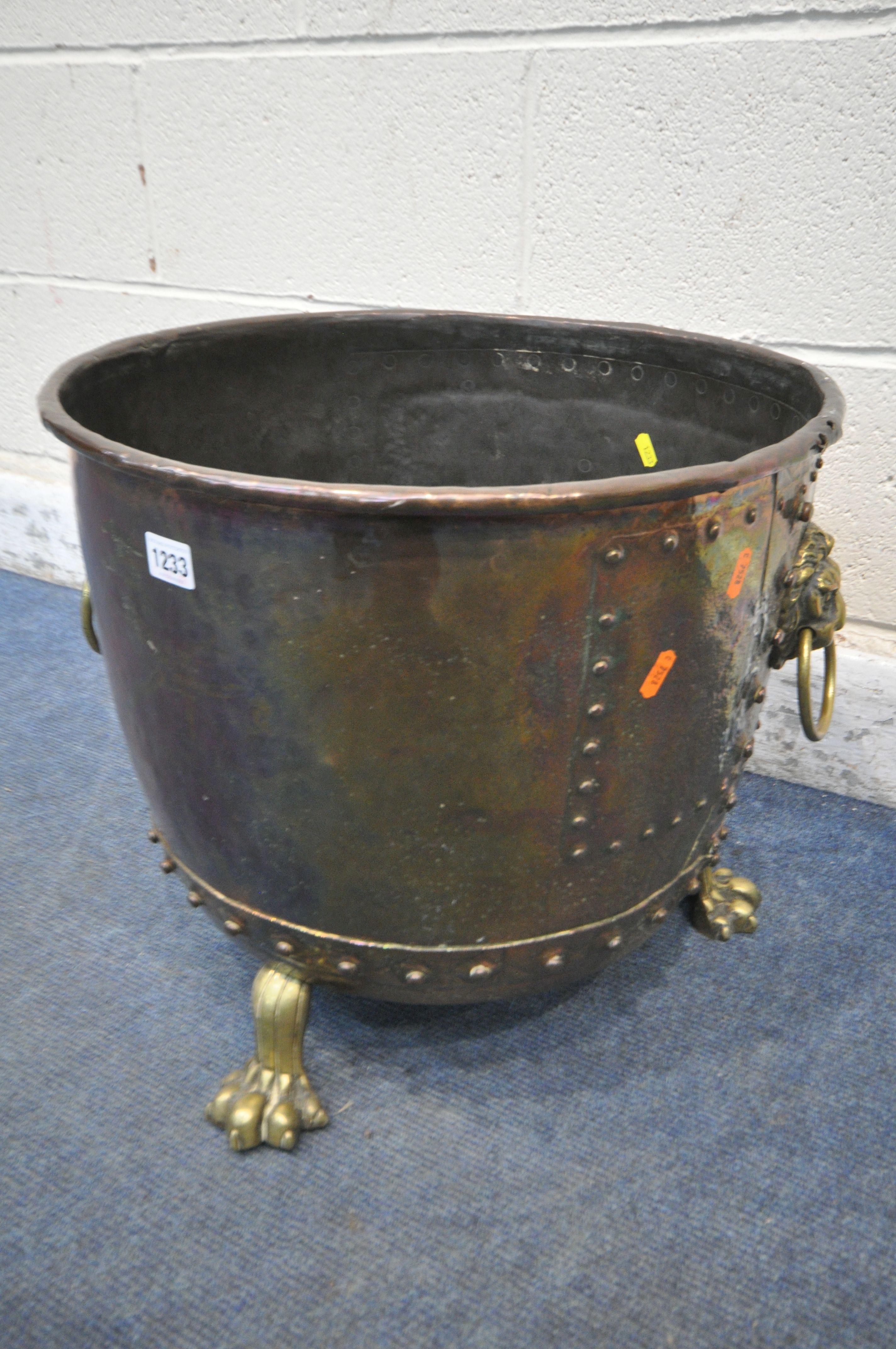 A 19TH CENTURY RIVETED BRASS AND COPPER COAL BUCKET, with lions head handles, and triple paw feet, - Image 2 of 5