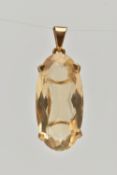 A 9CT GOLD CITRINE PENDANT, of an oval form, in a four claw setting, hallmarked 9ct London, fitted