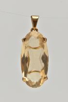 A 9CT GOLD CITRINE PENDANT, of an oval form, in a four claw setting, hallmarked 9ct London, fitted