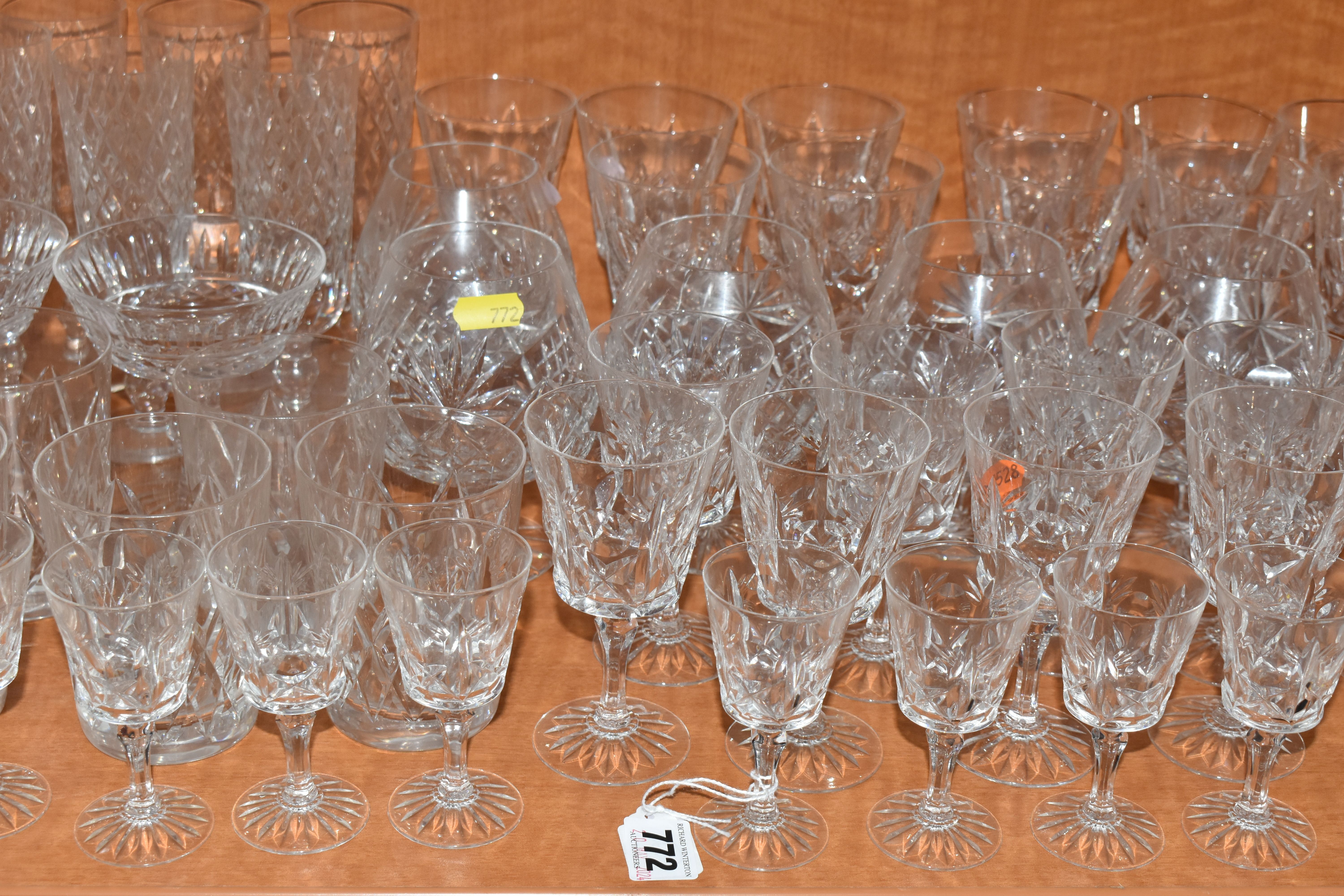 A COLLECTION OF ASSORTED DRINKING GLASSES. including a set of twelve champagne flutes, a set of