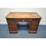 A VICTORIAN MAHOGANY TWIN PEDESTAL DESK, with an arrangement of nine drawers, on a plinth base,