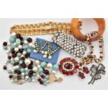 A BAG OF COSTUME JEWELLERY, to include two paste set necklaces, a three strand beaded necklace, a