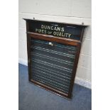 AN EARLY 20TH CENTURY MAHOGANY SINGLE DOOR DUNCAN'S PIPES OF QUALITY DISPLAY CASE, enclosing seven