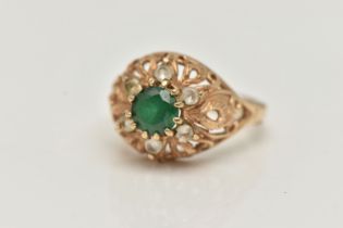 A 9CT GOLD GEM SET RING, the central circular gem possibly a soude emerald, with circular colourless