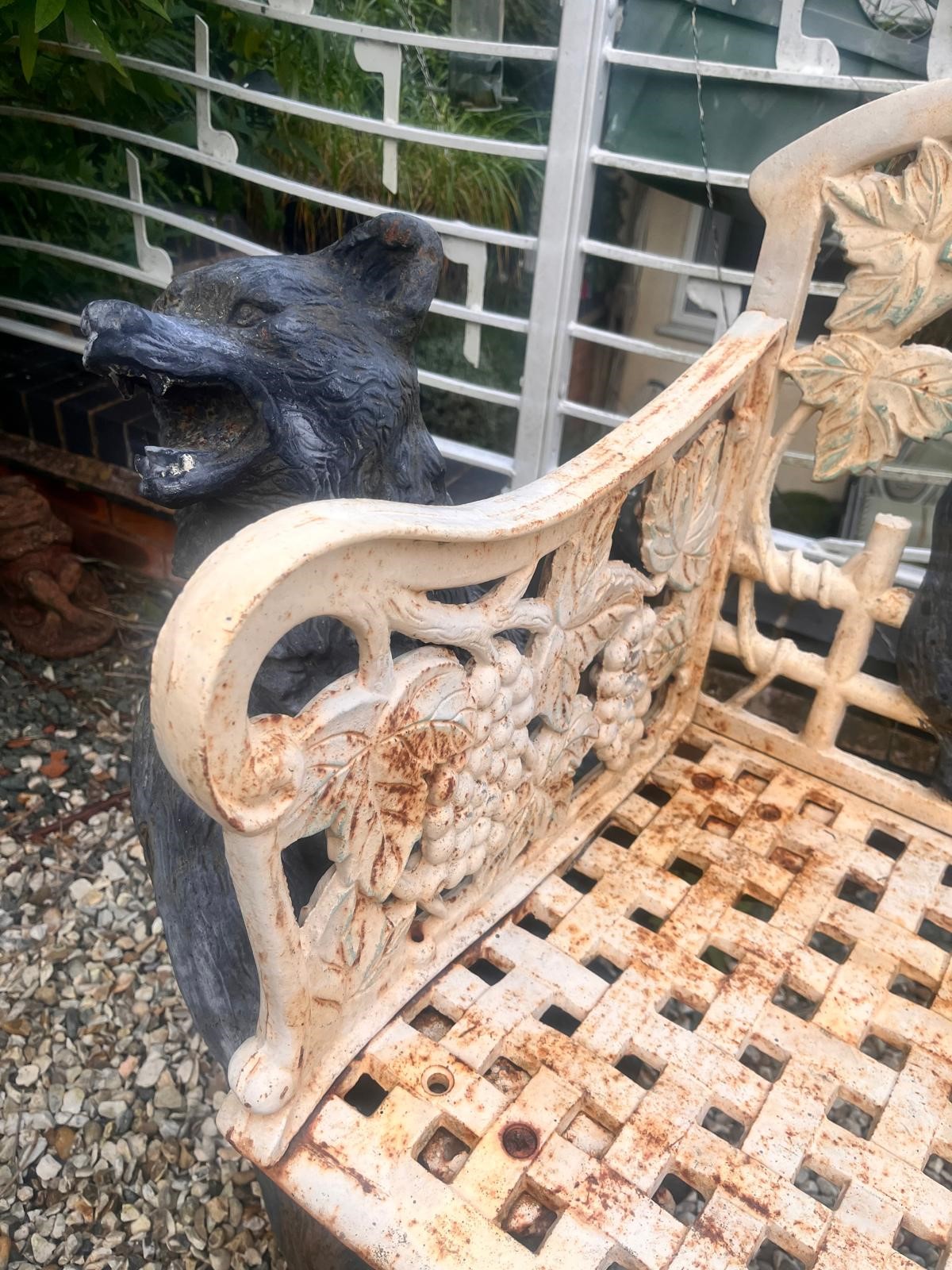 A CAST IRON BLACK FOREST STYLE GARDEN BENCH, the seat is supported by two angry black bears, the - Image 4 of 9