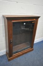 AN EDWARDIAN WALNUT SINGLE DOOR BOOKCASE, enclosing three adjustable shelves, width 83cm x depth