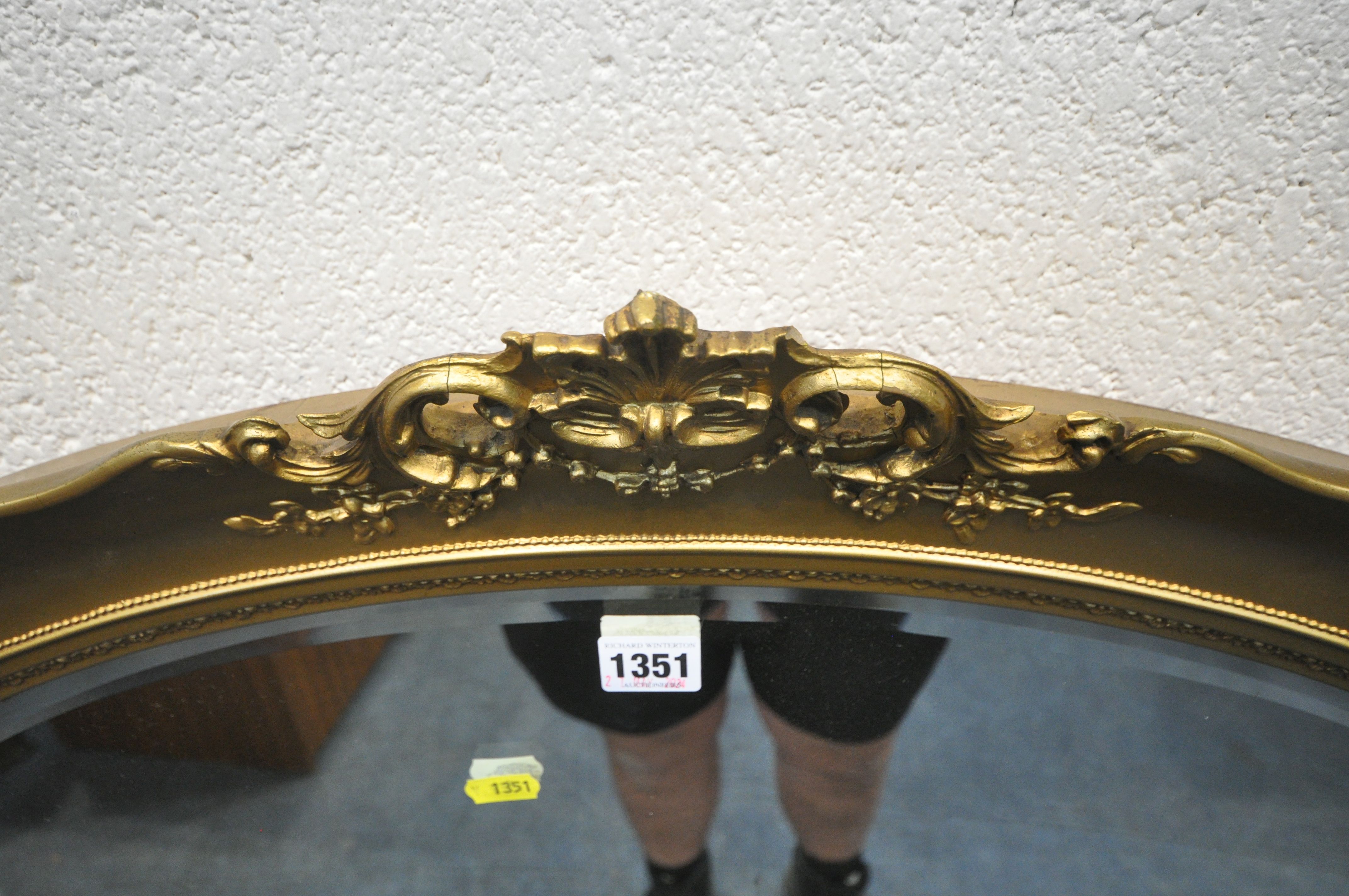 A GILT RESIN OVAL BEVELLED EDGE WALL MIRROR, with foliate details, 90cm x 69cm, a Regency style - Image 3 of 6