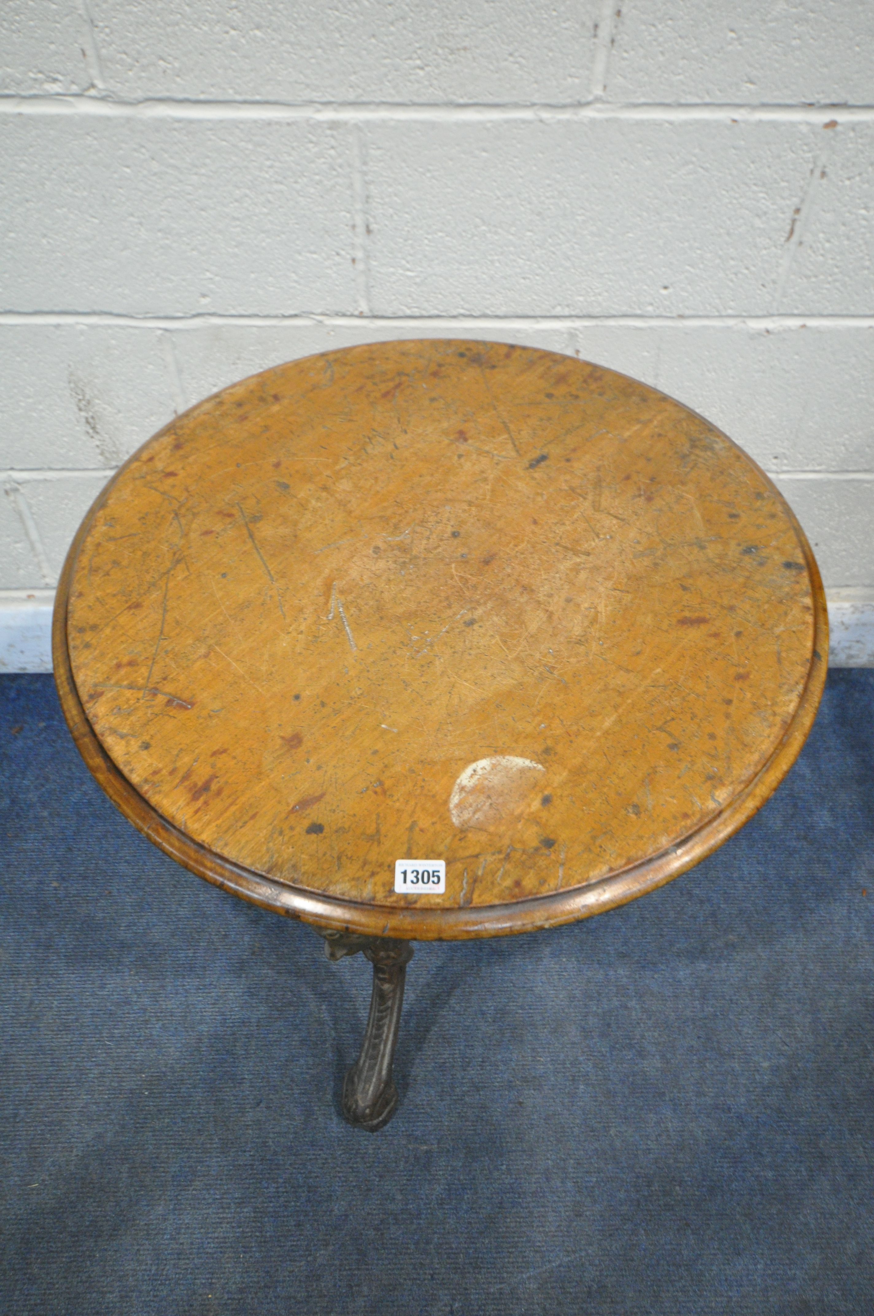 A CAST IRON CIRCULAR PUB TABLE, with a walnut top, diameter 61cm x height 70cm (condition report: - Image 2 of 3