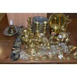 A LARGE COLLECTION OF BRASSWARE INCLUDING SERVING TRAYS with Indo-Persian motifs, a large range of