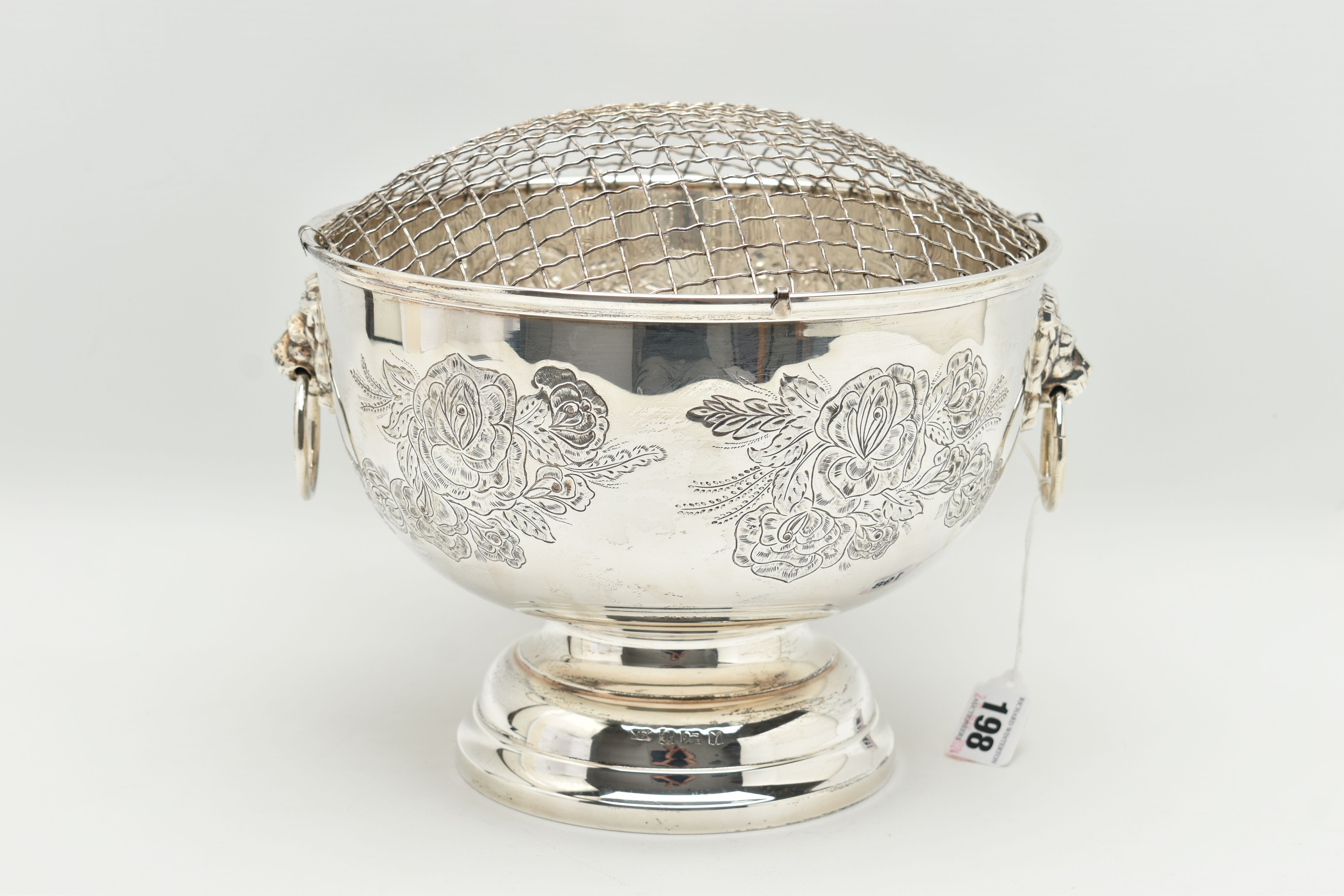AN ELIZABETH II SILVER ROSE BOWL, fitted with removable wire grille, two lion mask handles, the