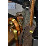 THREE SPLIT CANE FISHING RODS AND A COLLECTION OF WALKING STICKS, three vintage fishing rods with