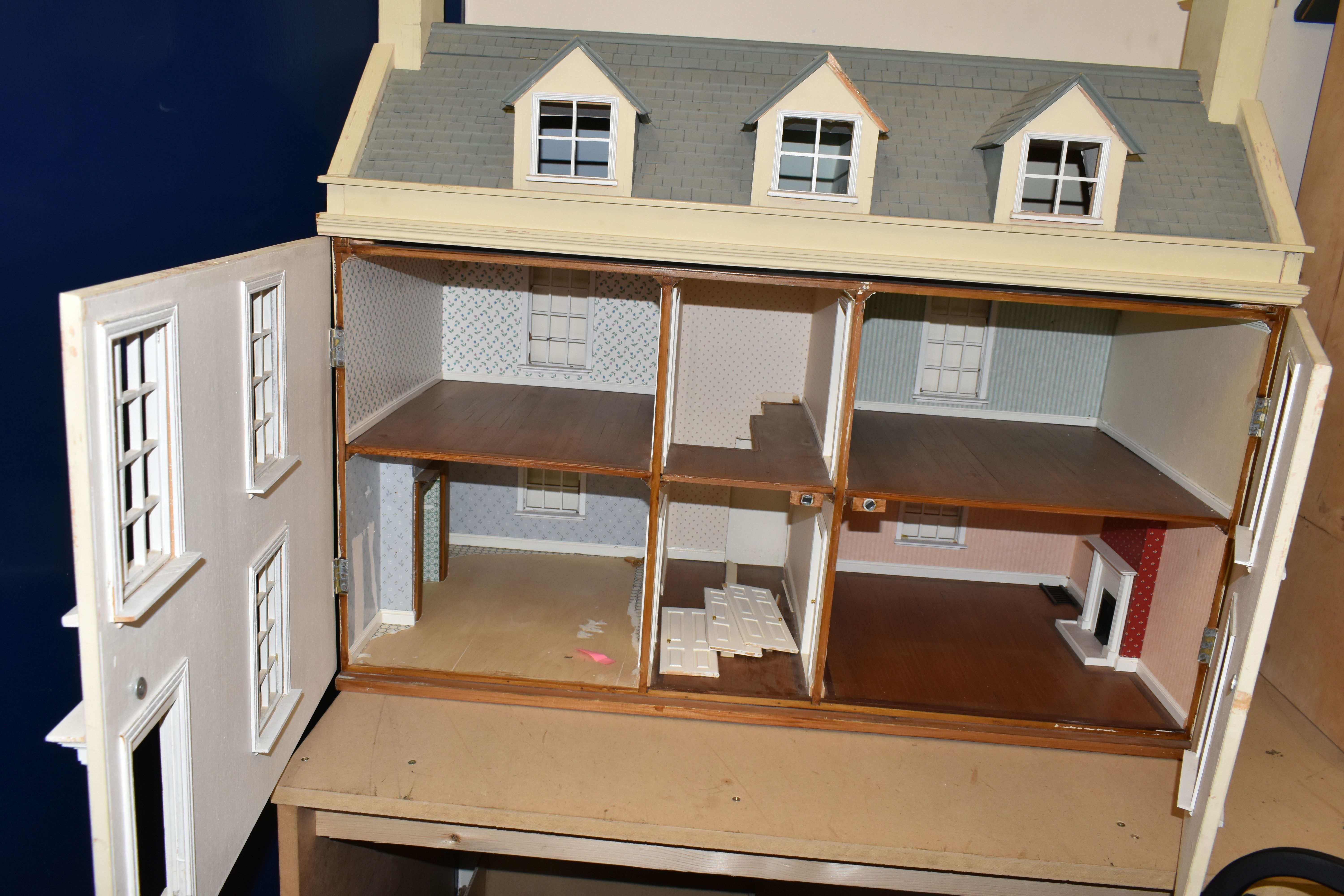 A LARGE MODERN WOODEN DOLLS HOUSE, modelled as a Georgian townhouse, front opening to reveal four - Image 3 of 4