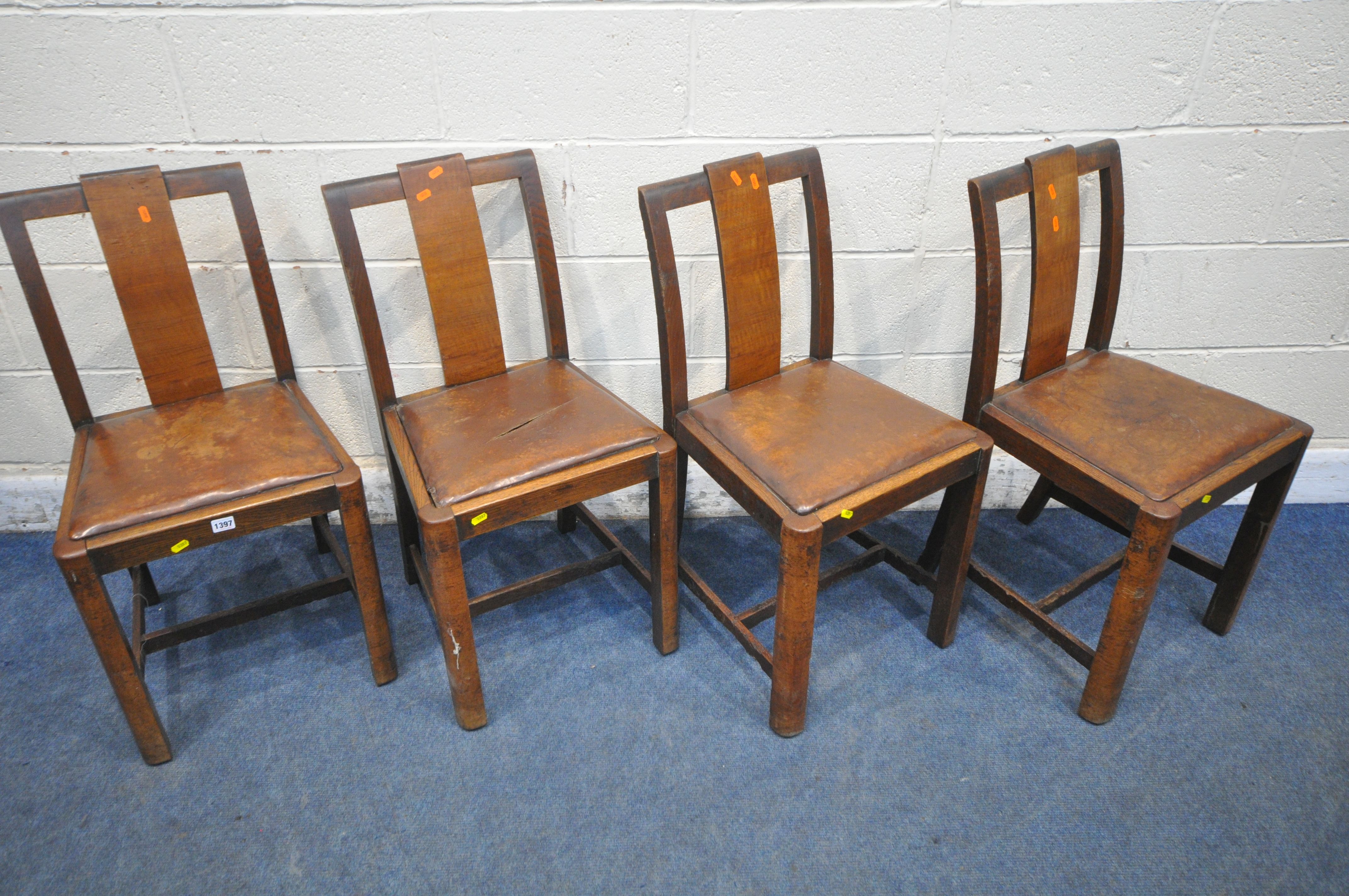 A SET OF FOUR ART DECO OAK DINING CHAIRS, with brown leather drop in seat pads (condition report: