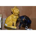 A MAJOLICA PIG MONEY BOX AND DOG FIGURE, comprising navy blue and brown glazed pig money box with