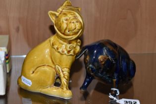 A MAJOLICA PIG MONEY BOX AND DOG FIGURE, comprising navy blue and brown glazed pig money box with