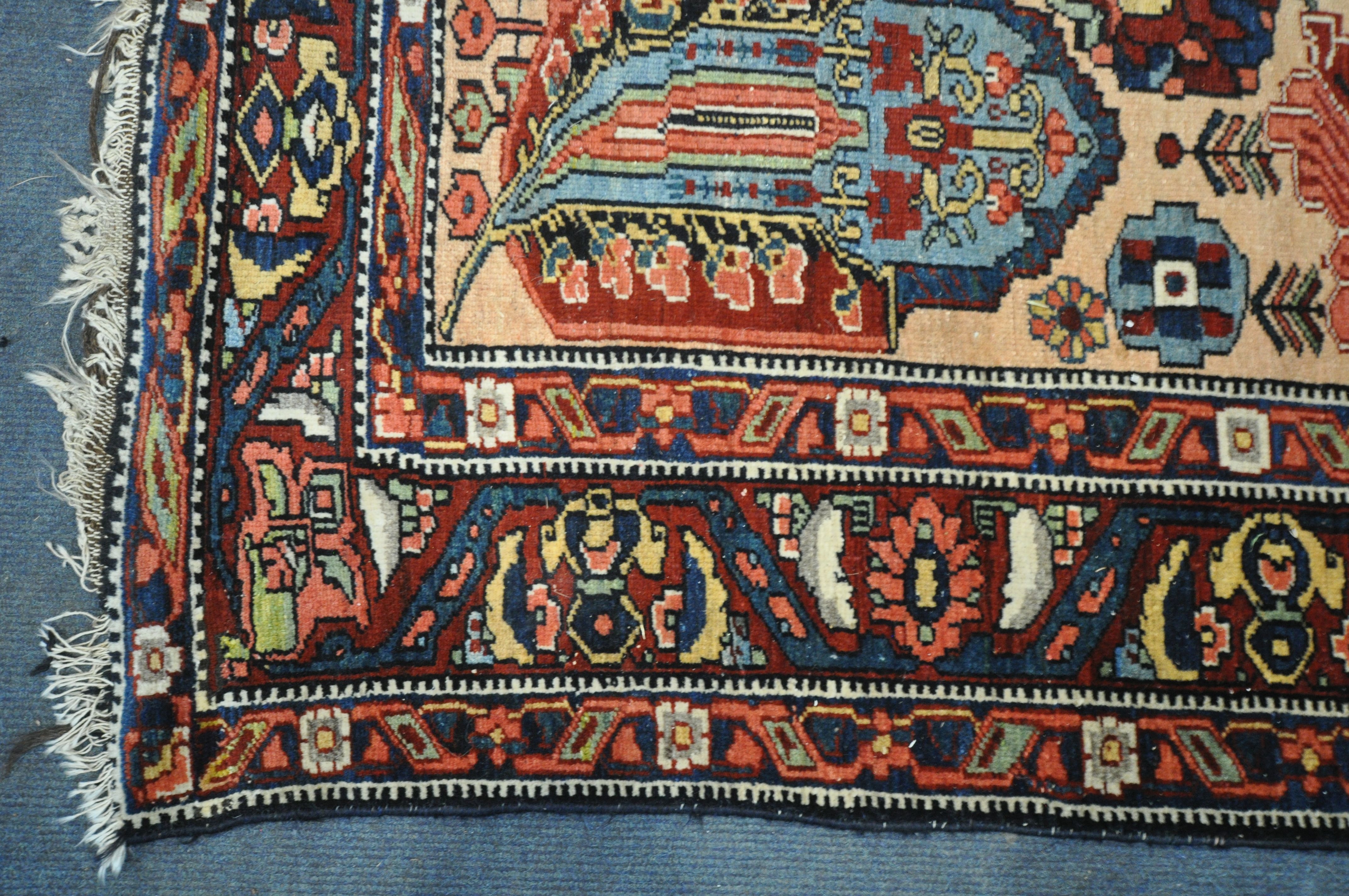 A PERSIAN MALAYER RUG, hand knotted with a repeating stylized pattern on a cream field, and - Image 5 of 7