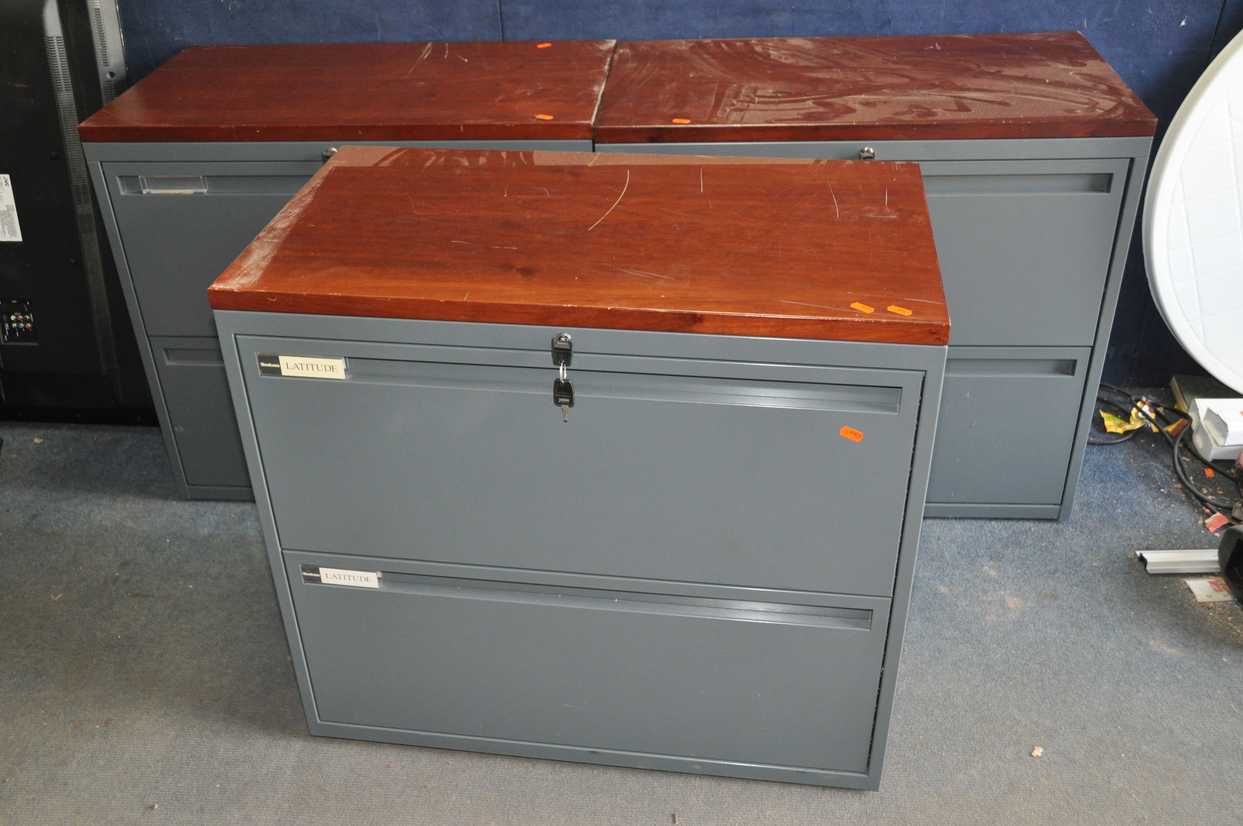 THREE 'STEELCASE LATTITUDE' METAL OFFICE FILE DRAWERS with two drawers to each, a Cherrywood