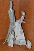 A LLADRO PORCELAIN FIGURE GROUP 'COUPLE WITH PARASOL', NO.4563, modelled with a dog at their feet,