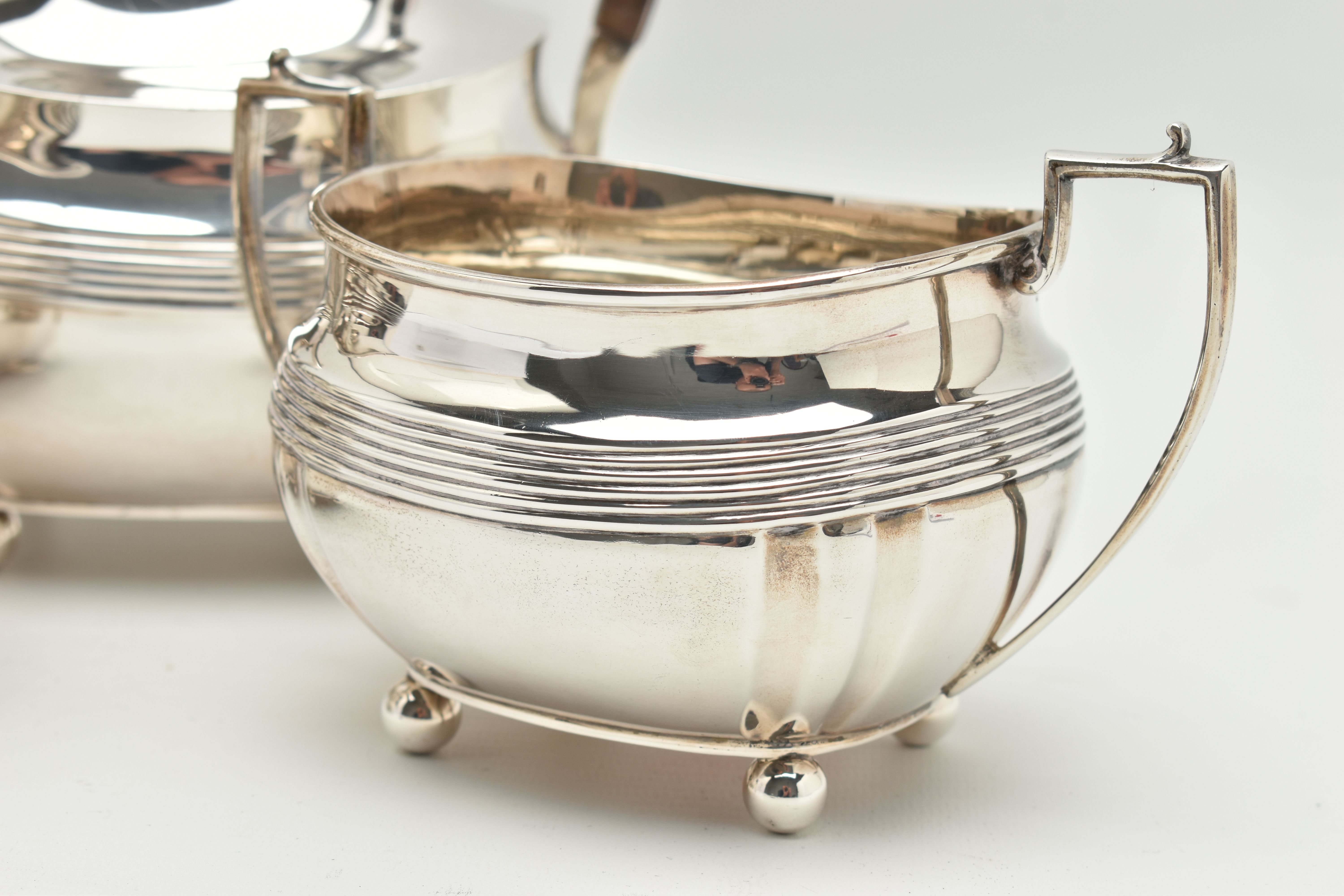 A GEORGE V SILVER FOUR PIECE TEA SERVICE OF SHAPED RECTANGULAR FORM, reeded horizonal band detail - Image 4 of 8