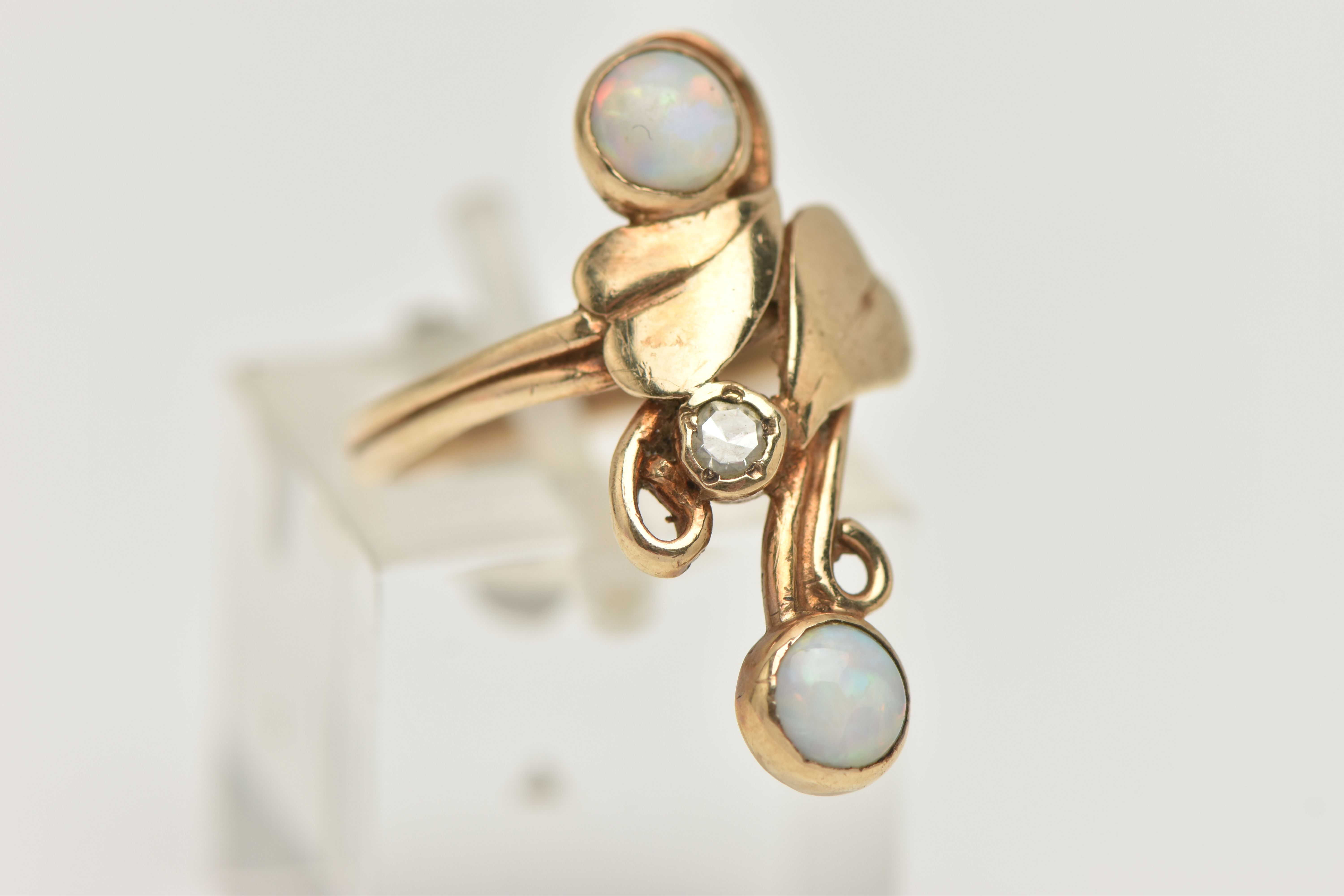 A 9CT GOLD OPAL AND DIAMOND RING, the up finger ring with central single cut diamond and foliate - Image 4 of 4
