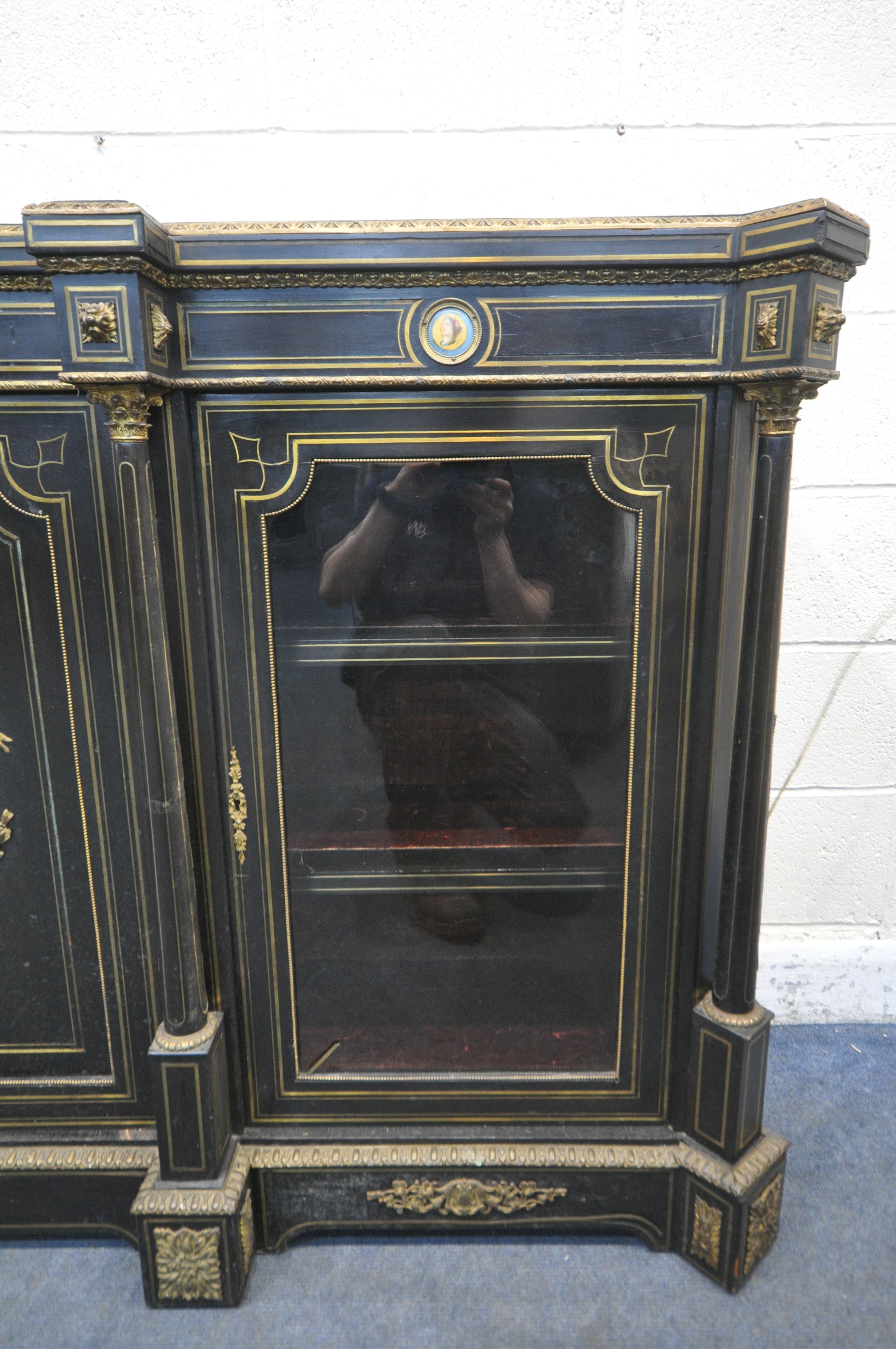 A 19TH CENTURY EBONISED AND GILT BRASS CREDENZA, with four moulded tops supporting Corinthian - Image 5 of 7