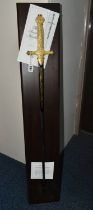 A REPRODUCTION FRANKLIN MINT SWORD OF NAPOLEON WITH WOODEN DISPLAY BOARD AND CERTIFICATES, gold