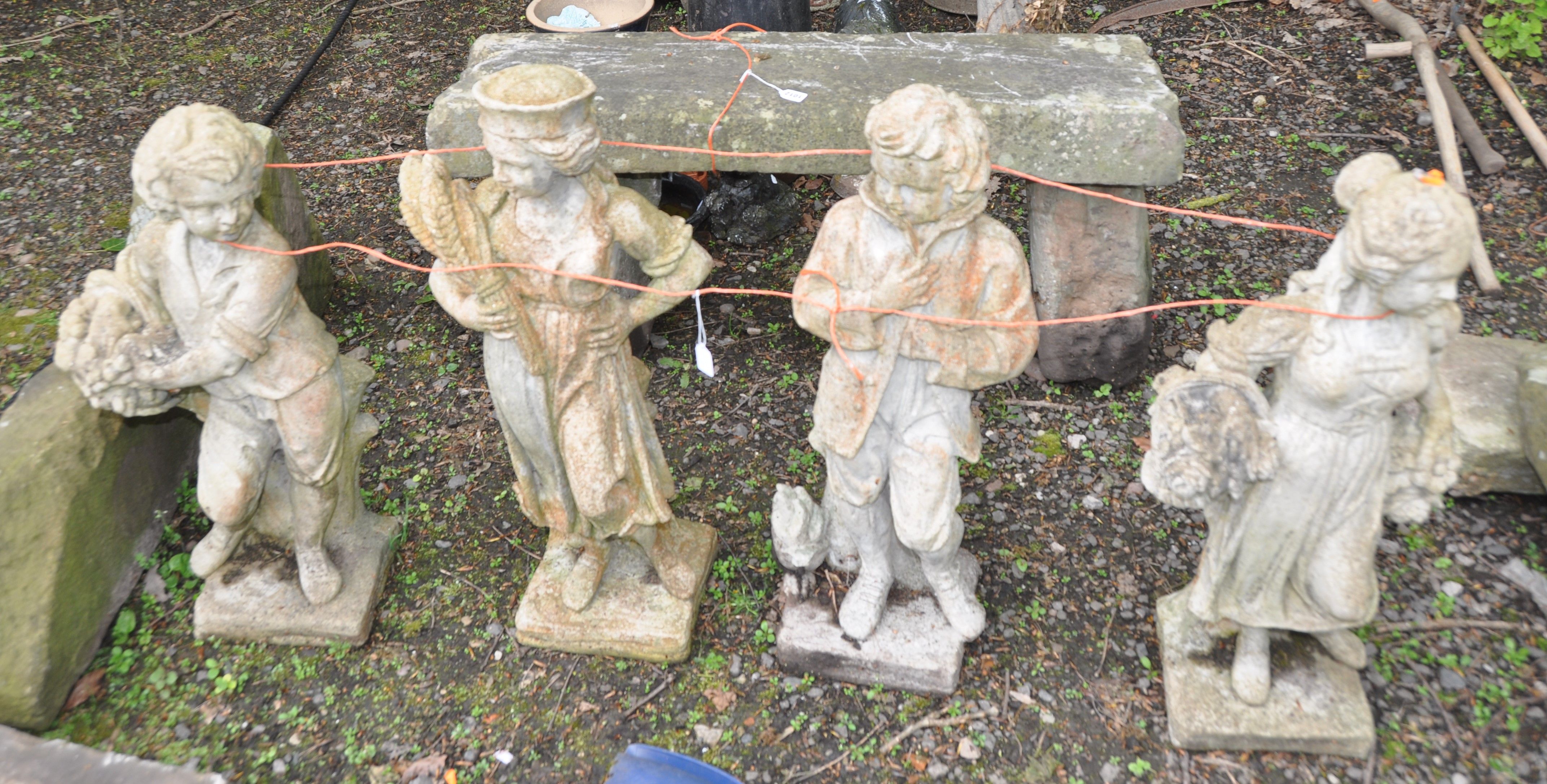 A SET OF FOUR COMPOSITE GARDEN FIGURES two male and two female (tallest being 77cm high)