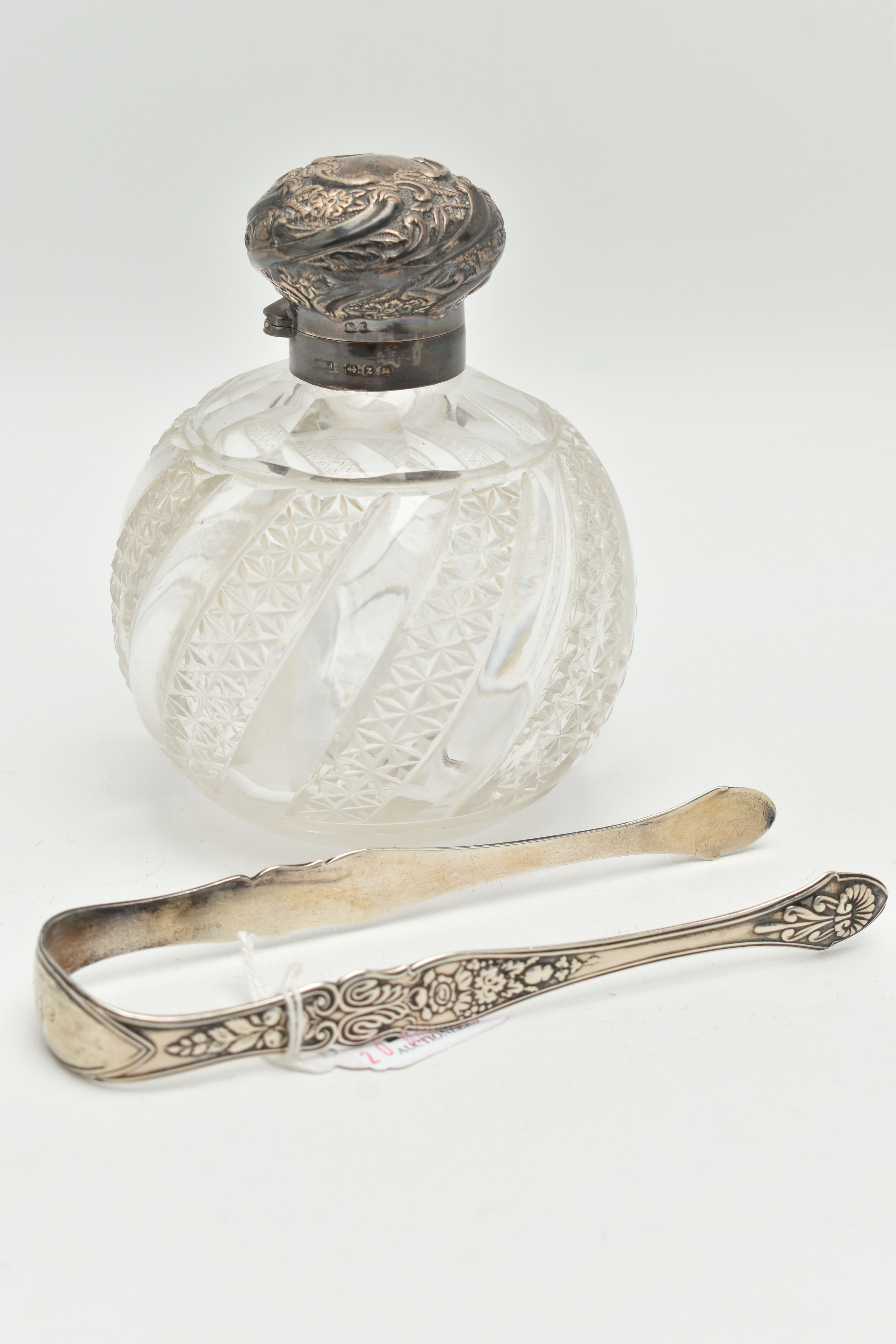 A PAIR OF SILVER SUGAR TONGS AND A SCENT BOTTLE, floral and fruit pattern tongs with engraved