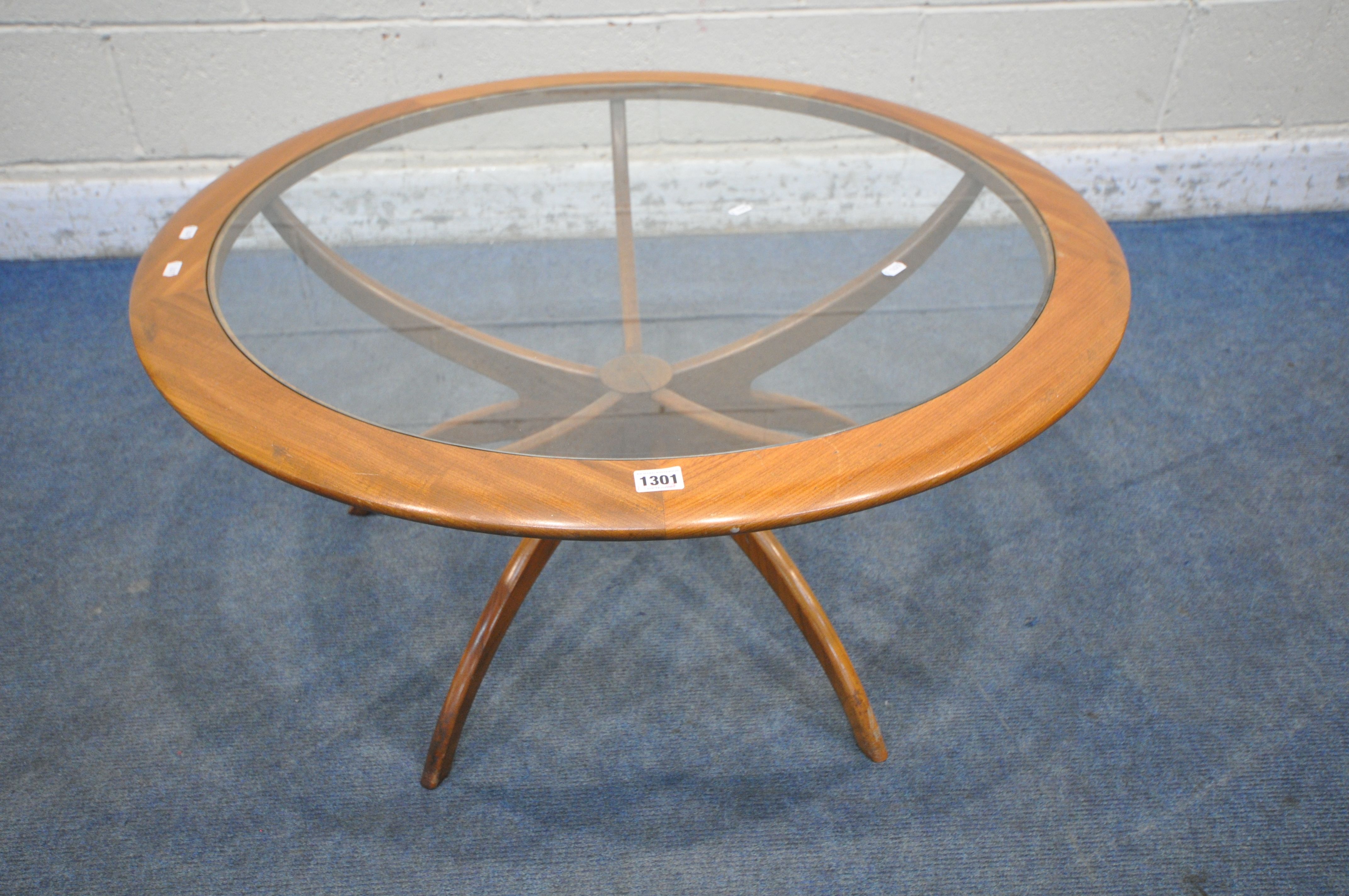 A MID CENTURY G PLAN ASTRO SPIDER COFFEE TABLE, with a glass insert, diameter 91cm x height 45cm (