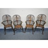 A SET OF FOUR EARLY 20TH CENTURY ELM AND BEECH HOOP BACK WINDSOR ARMCHAIR, with a wheel splat