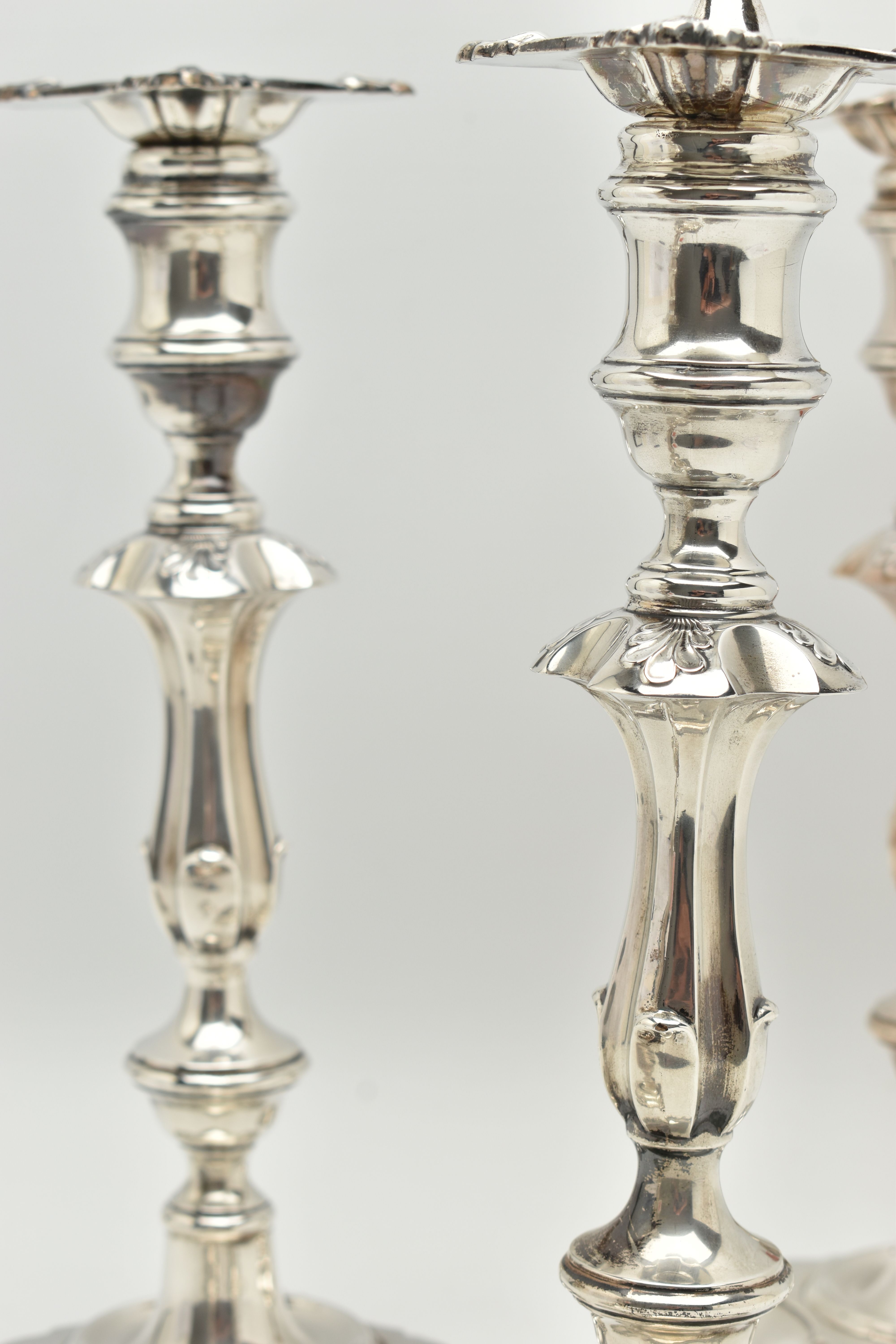 A GEORGE V SILVER SET OF FOUR CANDLESTICKS IN GEORGE II STYLE, with removable shaped square drip - Image 8 of 10
