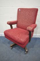 A 1940'S OAK SWIVEL CHAIR, on casters (condition report: worn fabric)