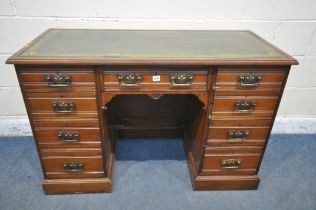 AN EDWARDIAN WALNUT KNEE HOLE DESK, with a green gilt tooled leather inlay writing surface, and an