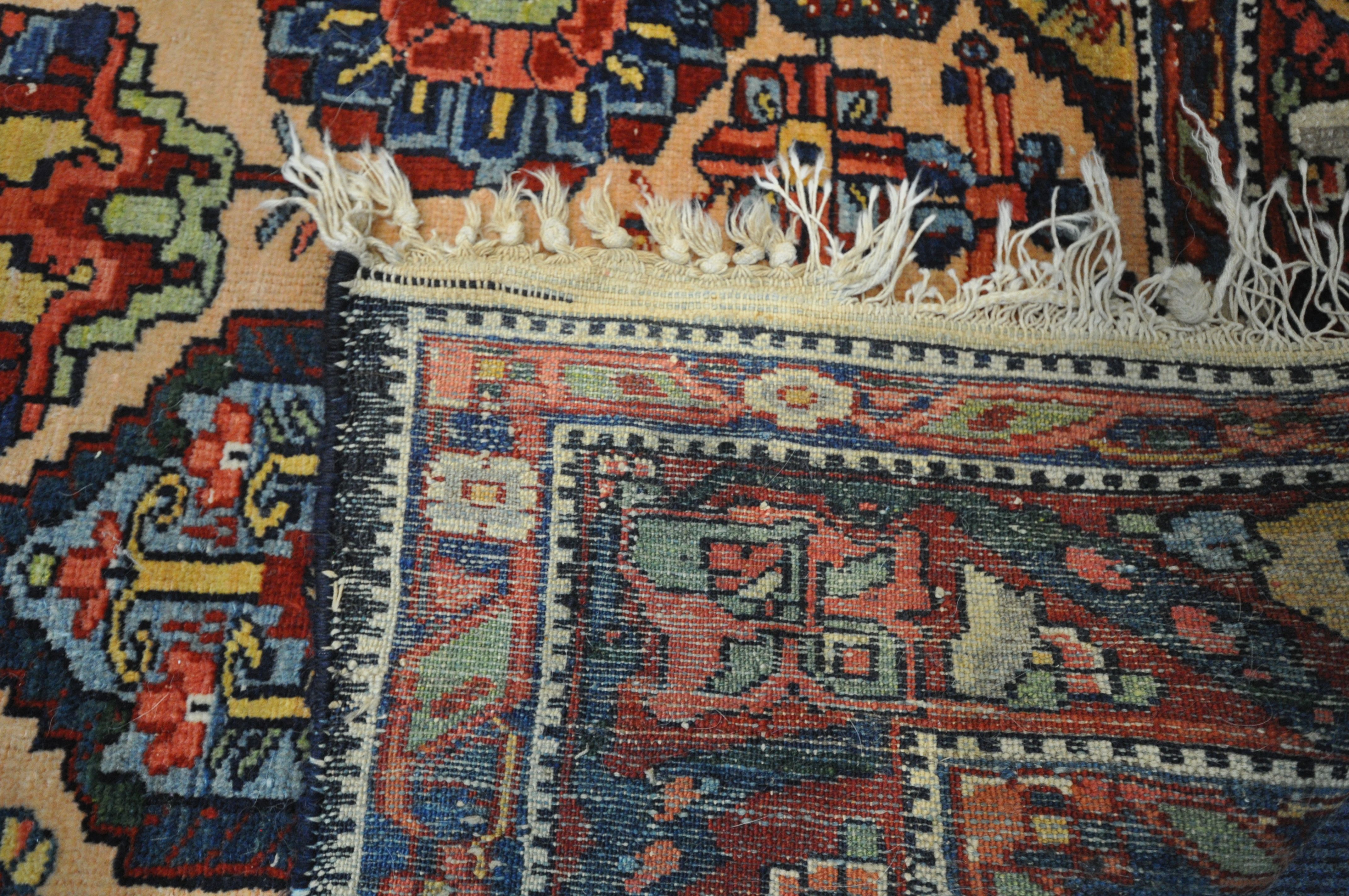 A PERSIAN MALAYER RUG, hand knotted with a repeating stylized pattern on a cream field, and - Image 7 of 7