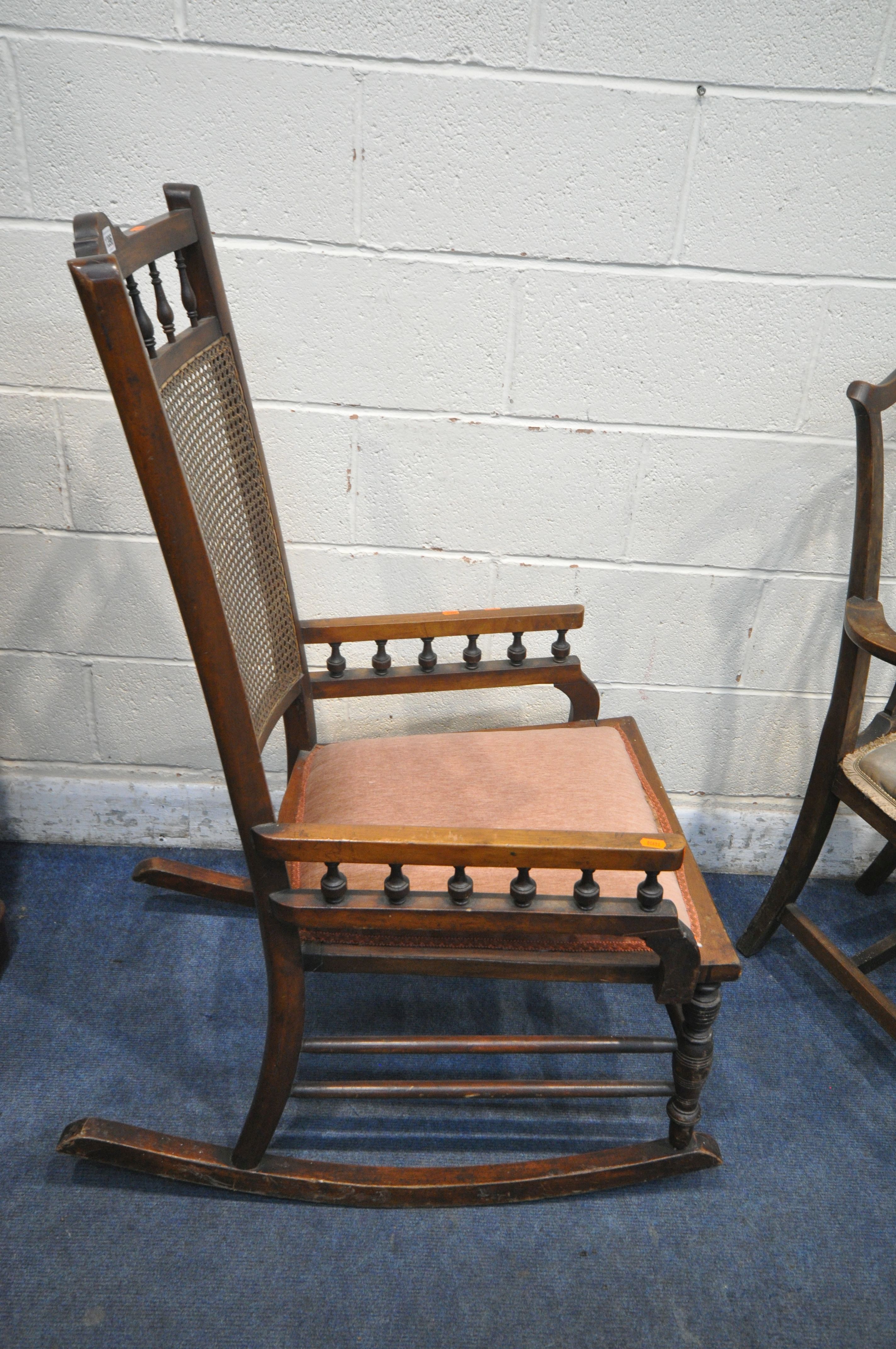 AN EDWARDIAN MAHOGANY BERGÈRE BACK ROCKING CHAIR, along with an oak open armchair, another - Image 2 of 4