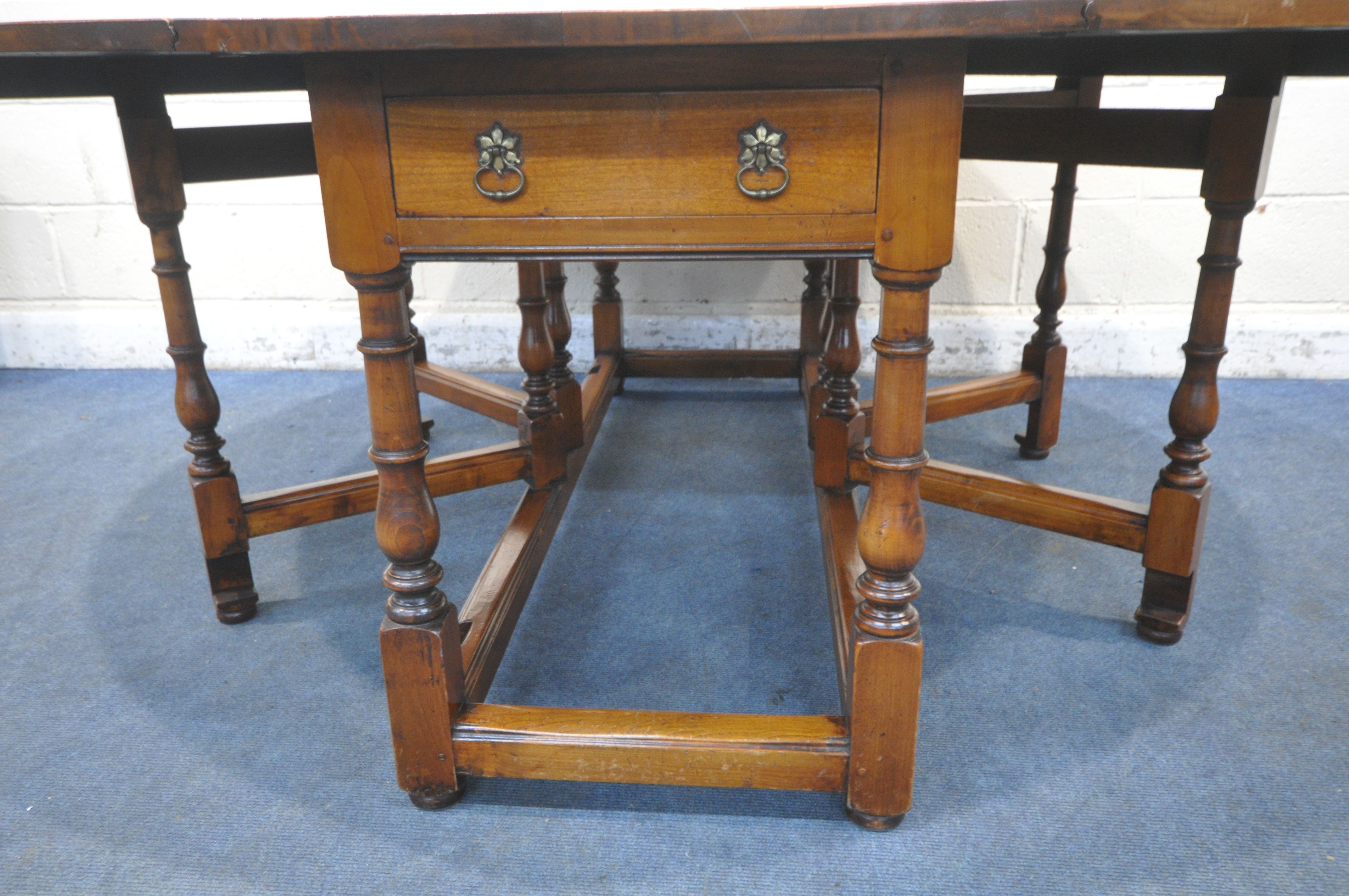 A GOOD QUALITY LARGE REPRODUCTION ELM DROP LEAF TABLE, with a single frieze drawer to each end, - Image 9 of 11