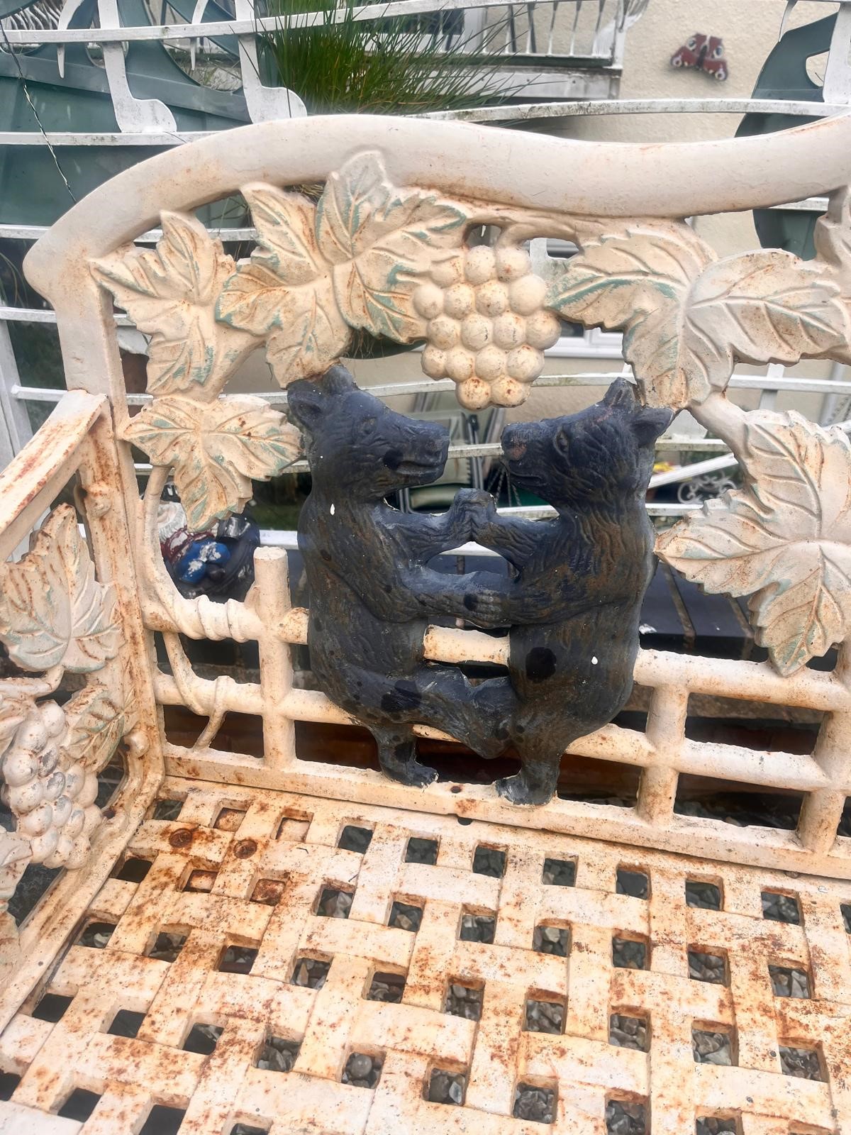 A CAST IRON BLACK FOREST STYLE GARDEN BENCH, the seat is supported by two angry black bears, the - Image 5 of 9