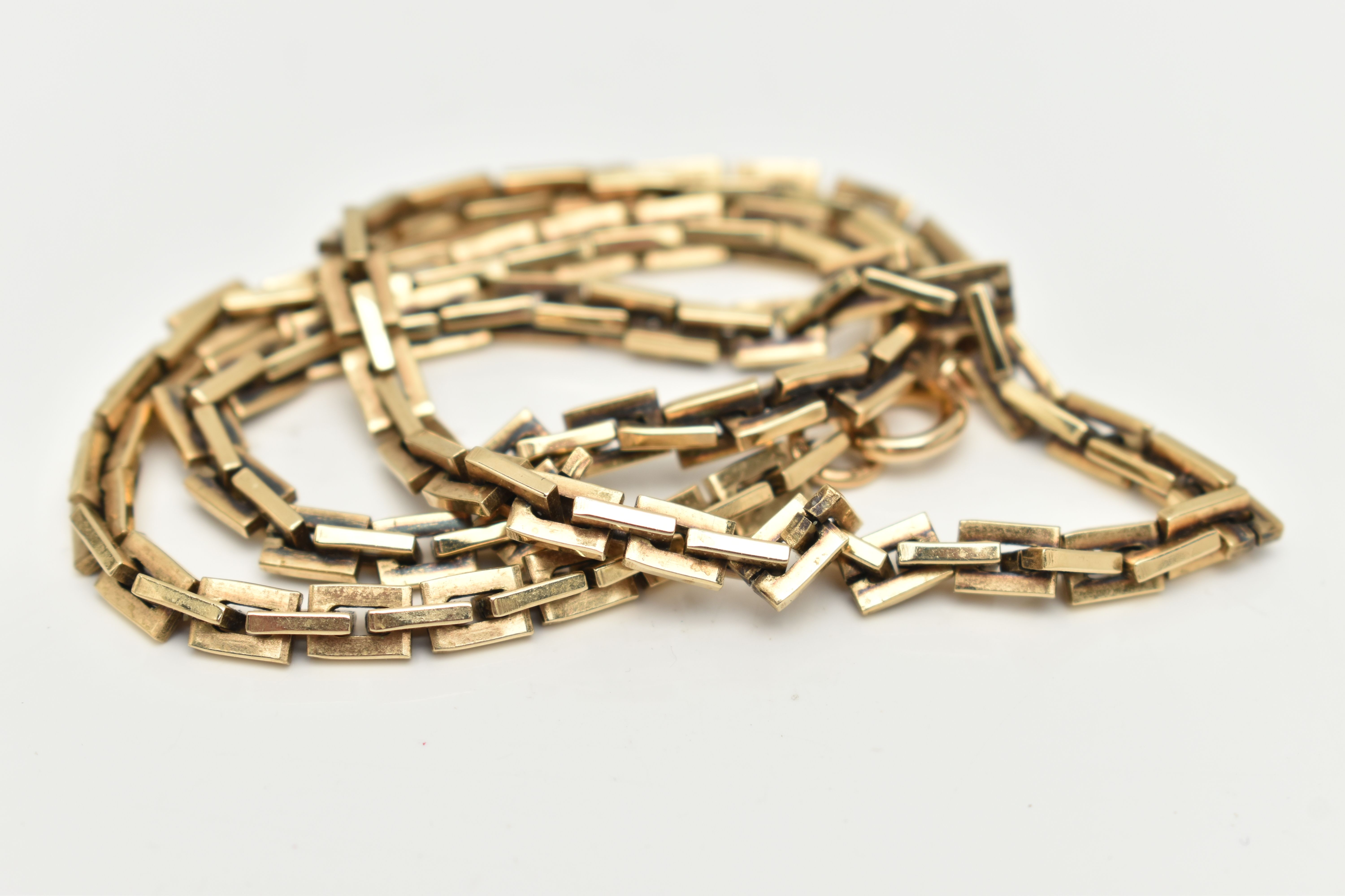 A 9CT GOLD FANCY LINK CHAIN, a rectangular link chain, fitted with a spring clasp, approximate